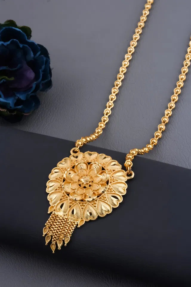 Gold plated women's Ki Mala mangalsutra with traditional design, featuring Moti Chen Ladi beads and a long, elegant pendant.