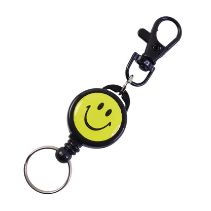 Wukusy smiley face retractable keychain with bright yellow design and metal clip, suitable for holding keys or accessories.