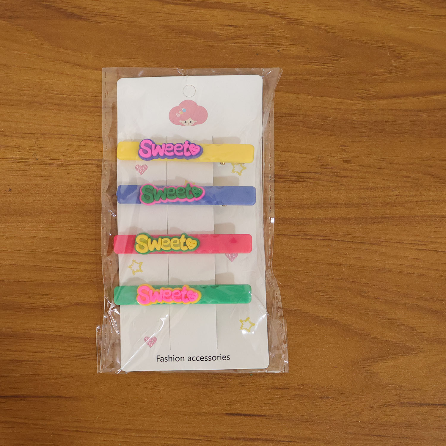 Set of four Wukusy Sweet Text decorative hair clips featuring colorful, playful designs for stylish hair accessories.