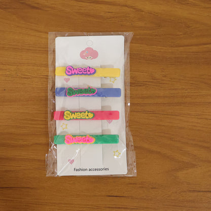 Set of four Wukusy Sweet Text decorative hair clips featuring colorful, playful designs for stylish hair accessories.