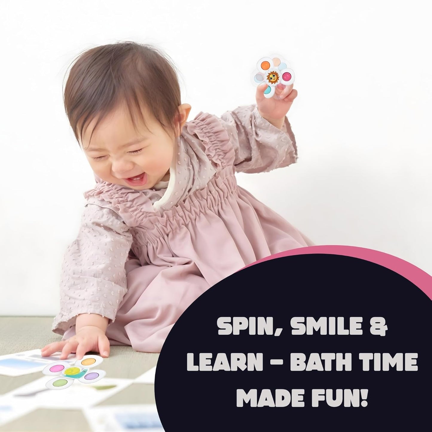 White Wukusy baby spinner toy set with three sensory suction spin toys for infants and sensory play.