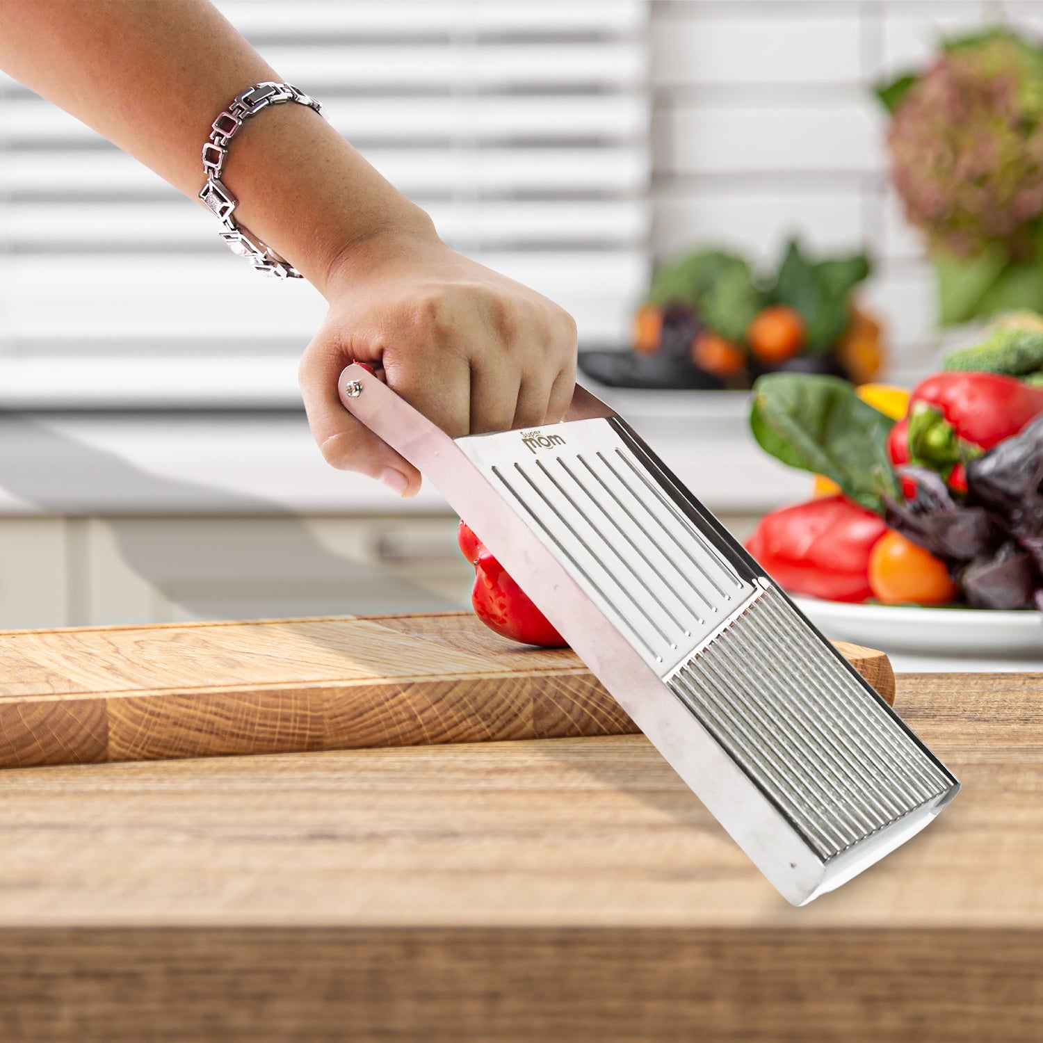 Wukusy Supermom stainless steel vegetable and fruit slicer with multiple blades for efficient kitchen prep.