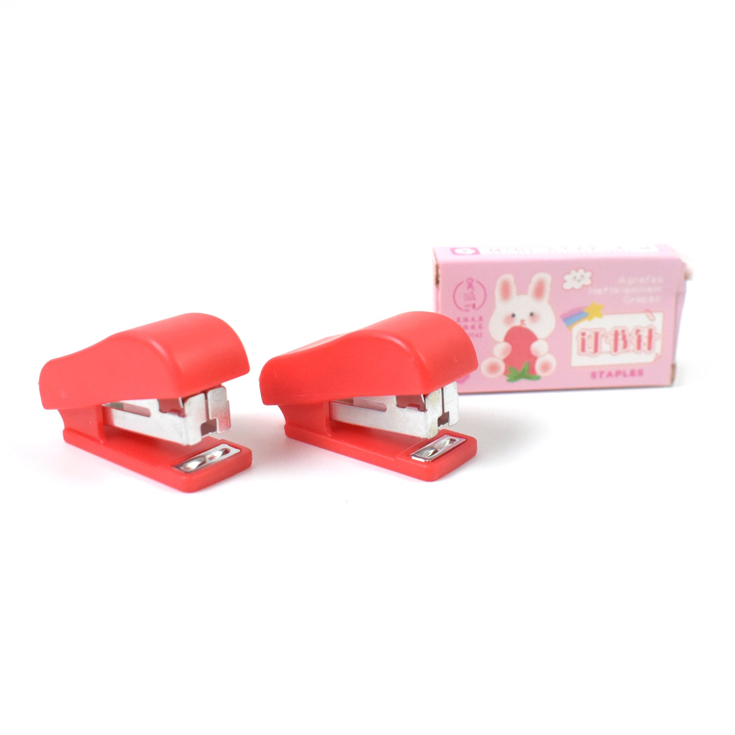 Wukusy mini office stapler with staples and pin set, compact and portable for quick stapling tasks in an office setting.