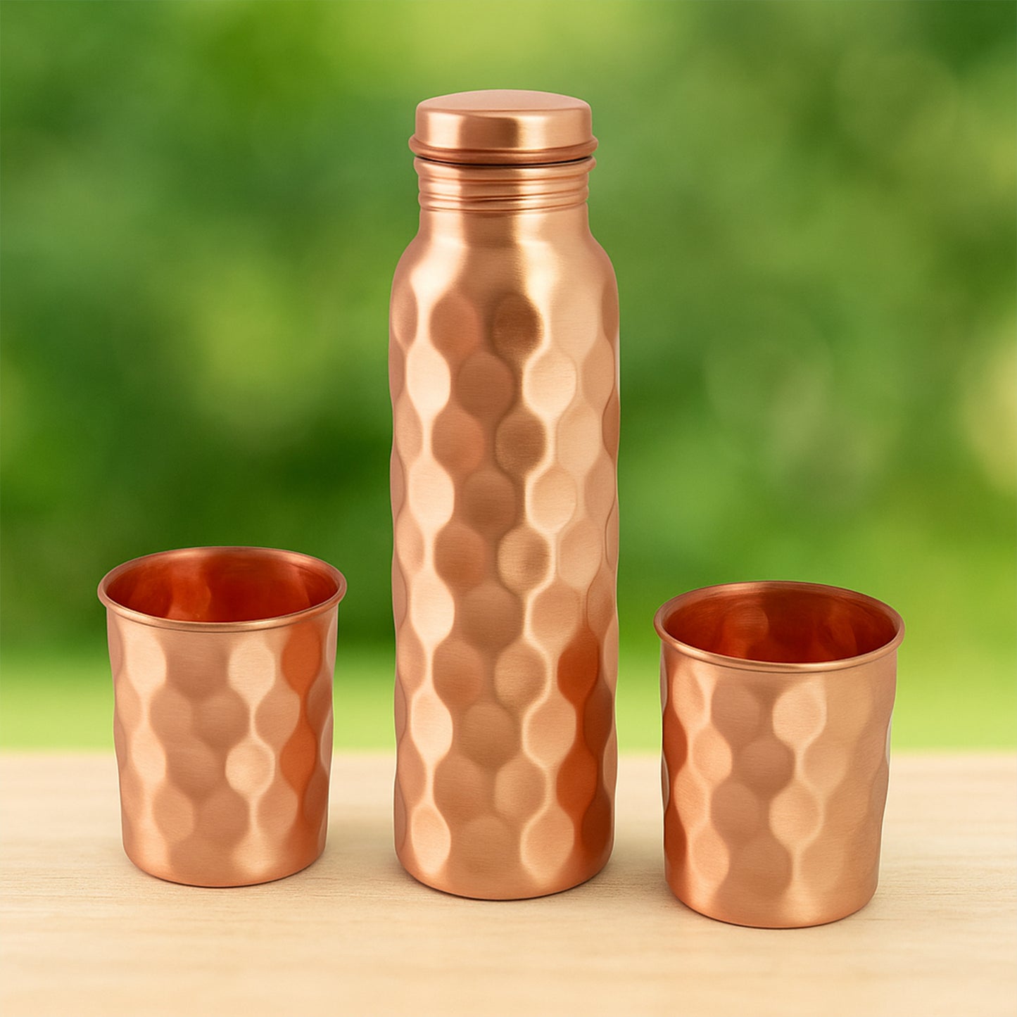 Diamond cut copper water bottle with two glasses and gift box, Wukusy 3-piece set, showcasing polished copper surfaces and elegant design.