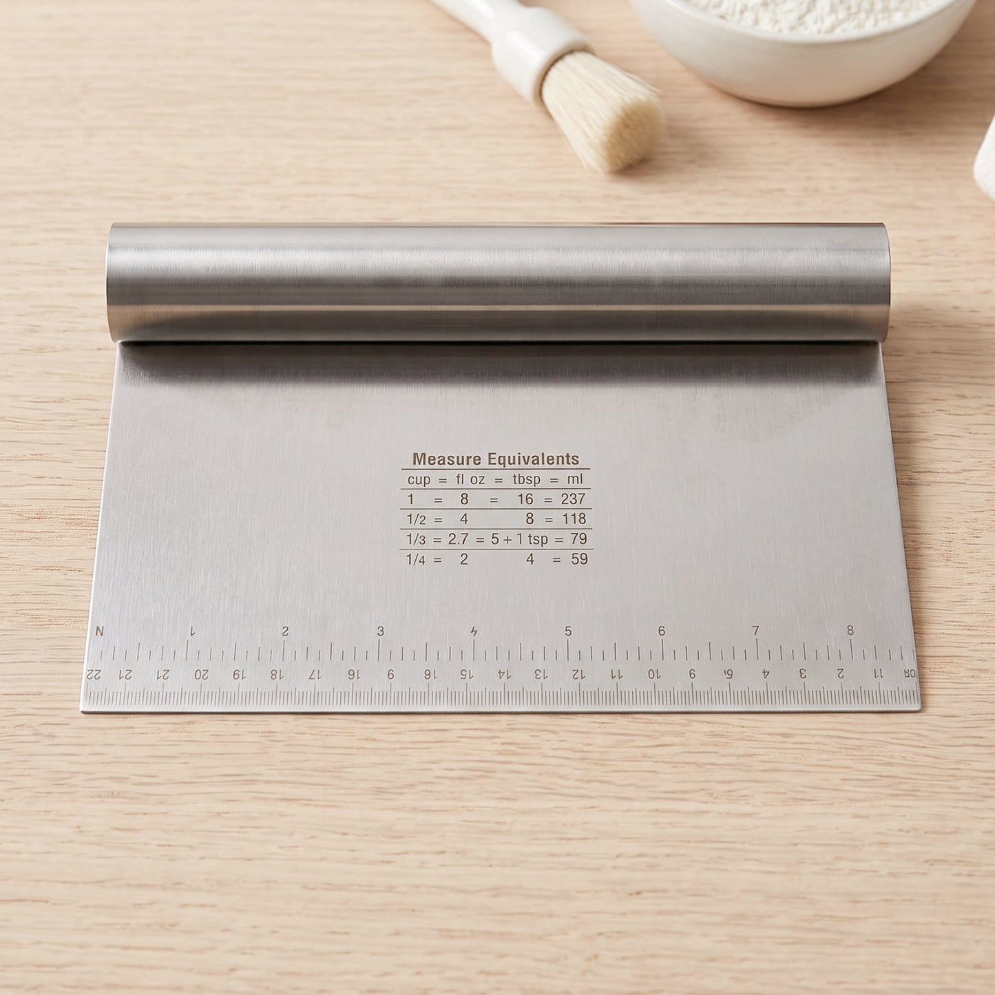 Wukusy stainless steel dough scraper cutter with scale, 22x12 cm, showing a close-up of the durable, polished blade with measurement markings.