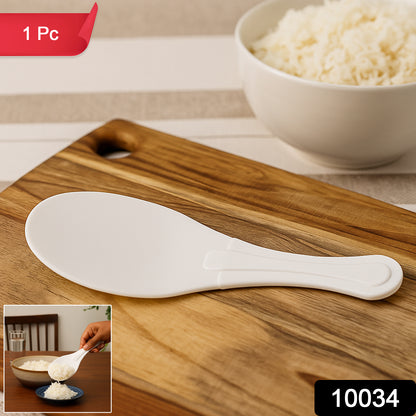 Wukusy plastic non-stick rice serving paddle, 6-inch kitchen utensil for serving and handling cooked rice.
