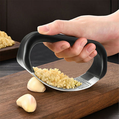 Wukusy stainless steel garlic presser crusher in multicolor, with ergonomic handle and compact design for easy garlic crushing.