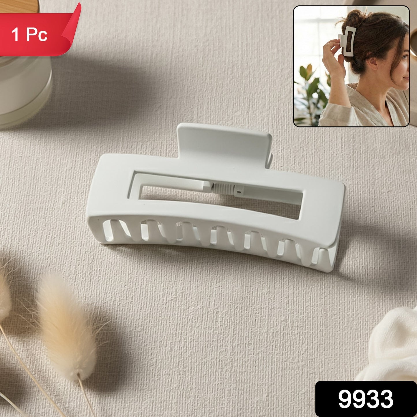 Large stylish plastic hair clip by Wukusy holding hair, featuring a sleek design and durable build in a close-up shot.