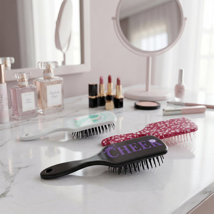 Colorful kids hair brush by Wukusy with fun mixed designs, featuring soft bristles and a colorful handle for gentle styling.