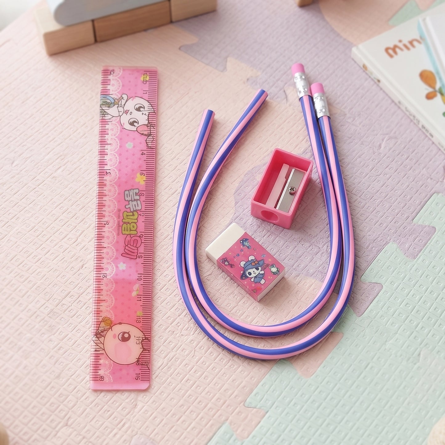 Kids school stationery kit by Wukusy featuring a 5-in-1 cute cartoon set with flexible pencils and colorful school supplies.