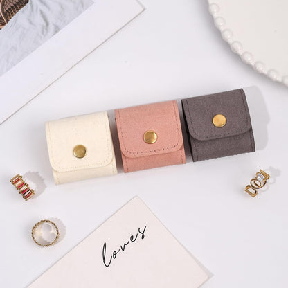 Wukusy compact foldable jewelry storage pouch with wallet, featuring organized compartments for jewelry and accessories.