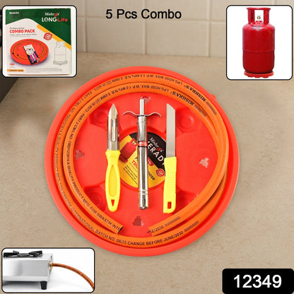 Wukusy Mishras 5-piece LPG kitchen combo set with gas pipe, cylinder trolley, knife, lighter, and peeler, all arranged on a kitchen countertop.