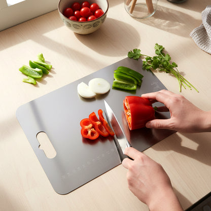 Large stainless steel chopping cutting board by Wukusy, showing a smooth, shiny surface ideal for food prep and chopping tasks.
