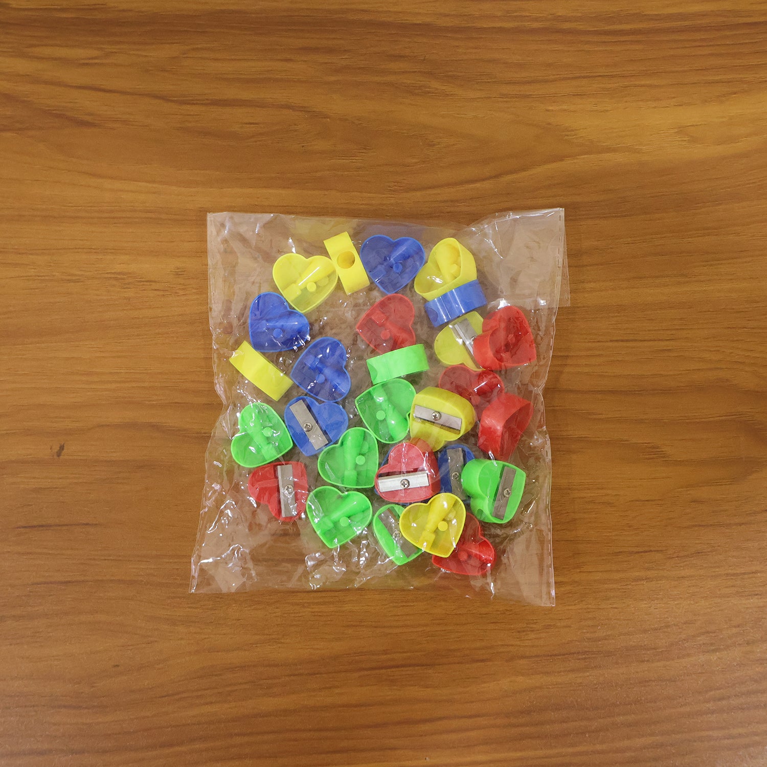 Set of six Wukusy heart-shaped pencil sharpeners in various colors, designed for precise pencil sharpening and decorative use.
