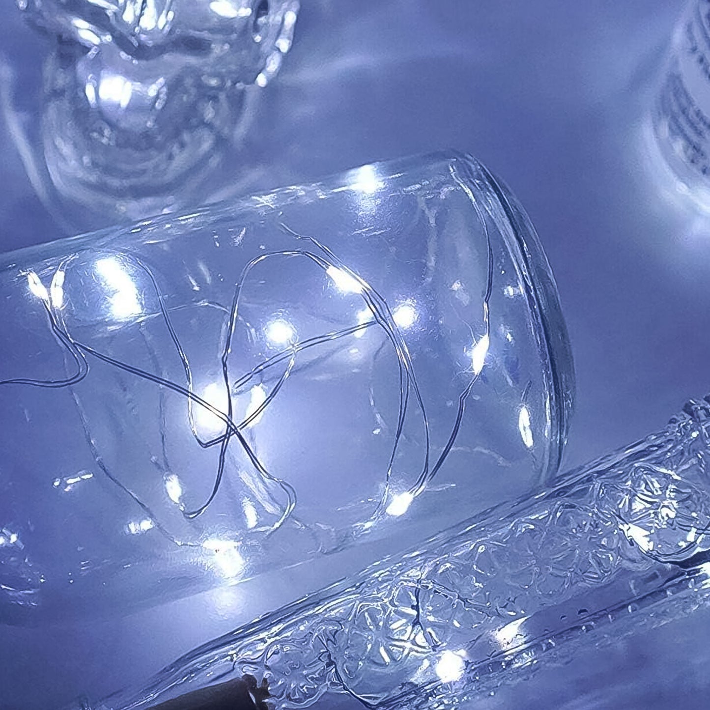 Wukusy wine bottle cork string light with multi-LED bulbs on 2m copper wire, battery-operated for home décor or ambient lighting.