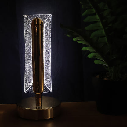 Elegant tall cylindrical crystal table lamp by Wukusy with a clear glass shade and metallic base, ideal for modern decor.