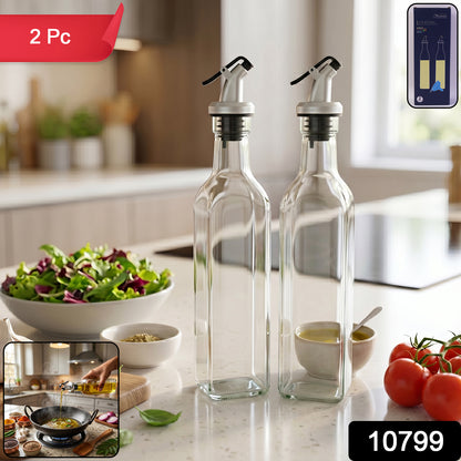 Pair of transparent Wukusy glass oil dispenser bottles with leak-proof spouts, ideal for olive oil and vinegar storage.