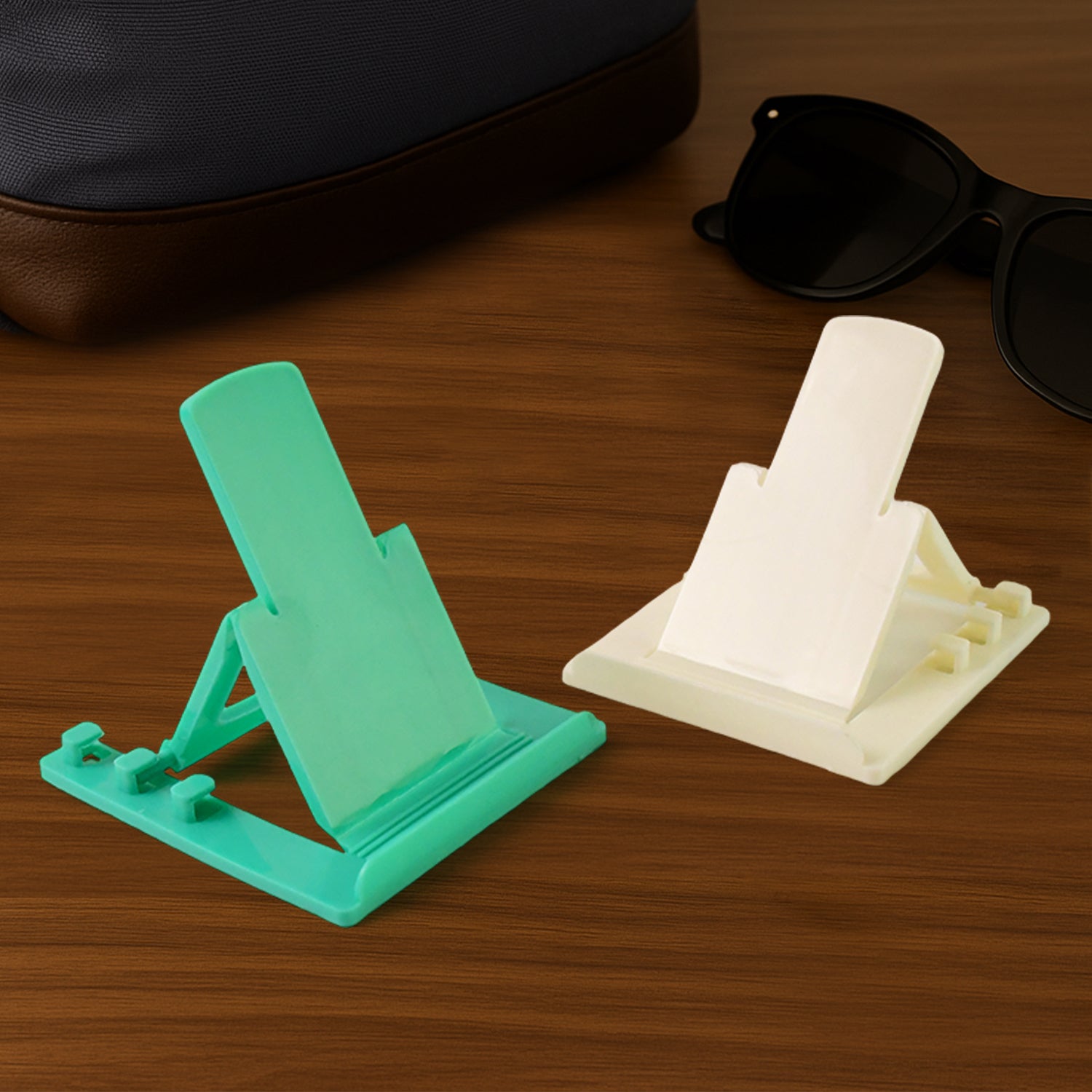 Two Wukusy adjustable foldable plastic mobile phone stands, lightweight and portable for hands-free use and easy adjustment.
