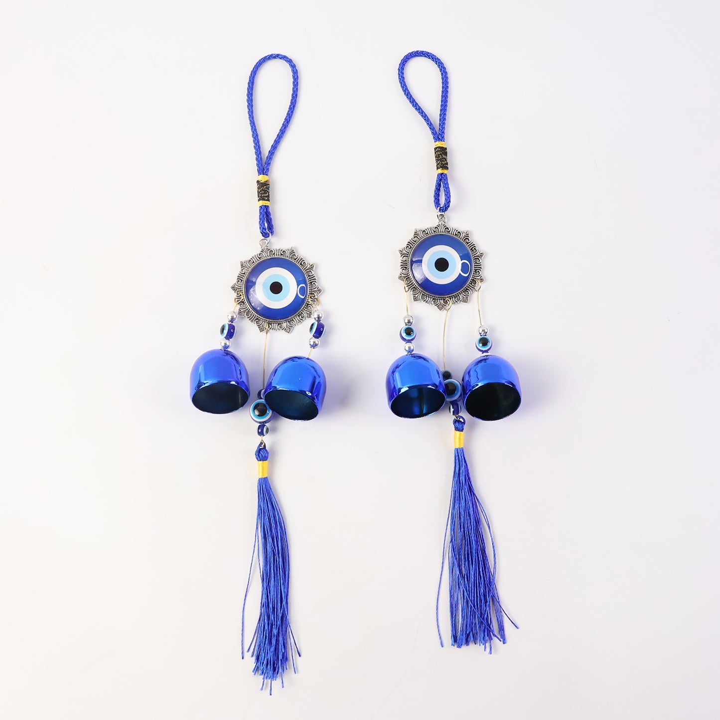Decorative evil eye hanging wind chime set with two pieces by Wukusy, featuring colorful eye charms and metal chimes.