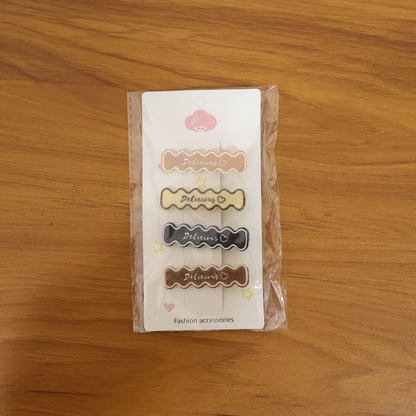 Set of four elegant Wukusy hair clips with sleek design, perfect for stylish hair accessories and everyday hair styling.