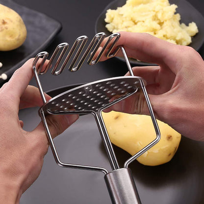 Wukusy stainless steel hand masher for potatoes, vegetables, and baby food, ideal for mashing dal, bhaji, and other cooked ingredients.
