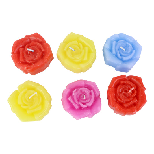 Six pink rose-shaped wax candles from Wukusy in a home decor set, arranged together on a neutral surface.