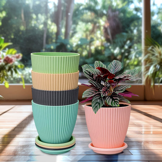 Set of five small Wukusy round flower pots with bottom trays, each approximately 14-16 cm in diameter, displayed with plants inside.