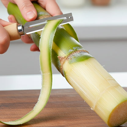 Stainless steel vegetable peeler by Wukusy, featuring a ergonomic handle and sharp blade for peeling fruits and vegetables.