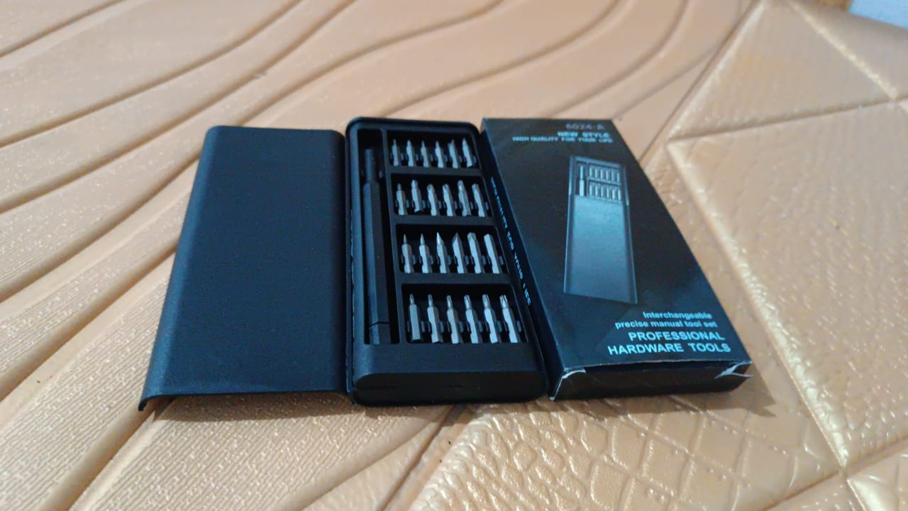 Wukusy plastic 24-in-1 precision screwdriver set with multiple interchangeable bits, displayed on a plain background.