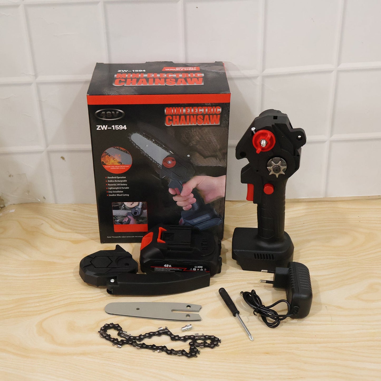 Wukusy mini electric cordless chainsaw with 48V battery for wood cutting, showing the compact chainsaw and battery in use.