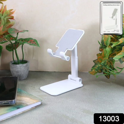 Wukusy adjustable foldable desktop mobile stand showing a smartphone held at an ergonomic angle for hands-free viewing.