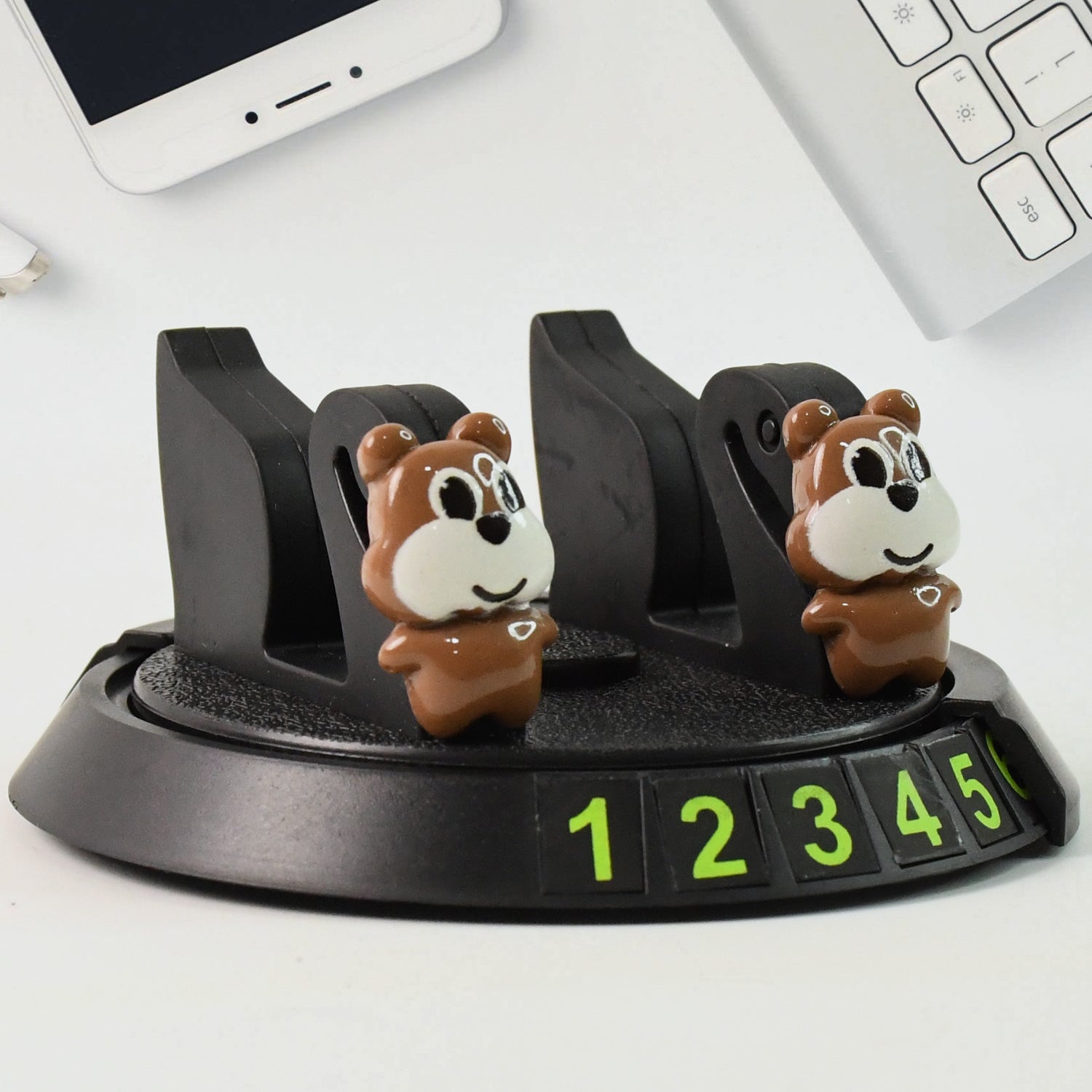 Wukusy multipurpose car dashboard mobile phone holder stand attached to a vehicle dashboard with a phone secured in place