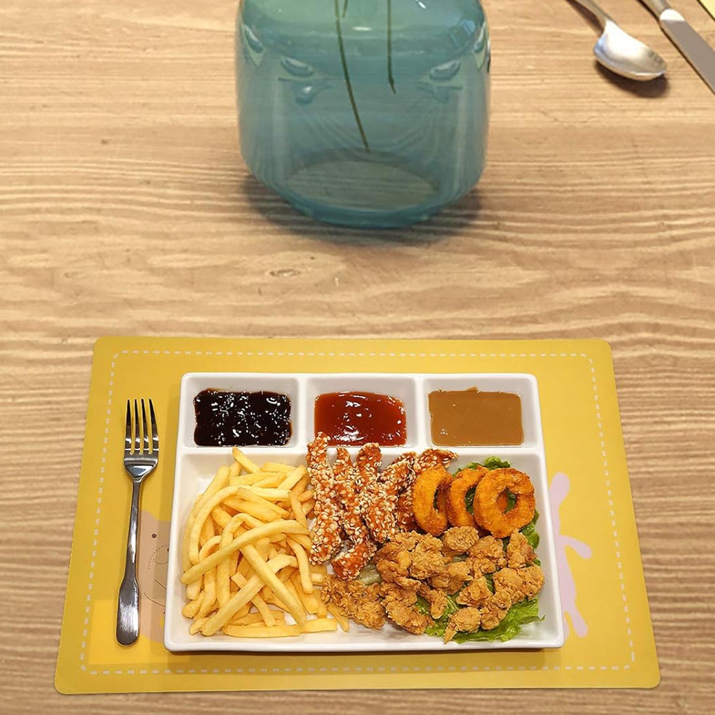 White plastic 4-compartment rectangular meal serving tray by Wukusy, ideal for home and kitchen use with separate sections for food.