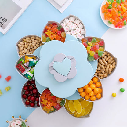 Wukusy rotating flower-shaped candy dish with multiple sections and phone holder, used for snacks and organizing small items.