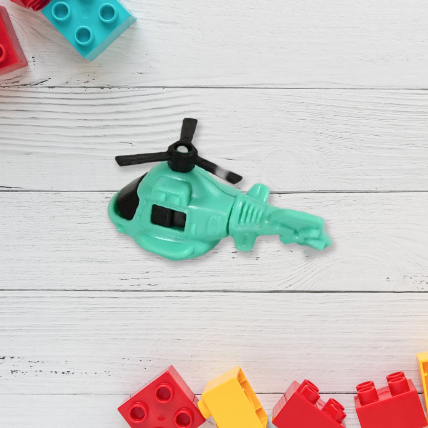 Wukusy 1929 small DIY helicopter toy for kids, featuring rotating tail and wings, made of colorful plastic for fun indoor play.