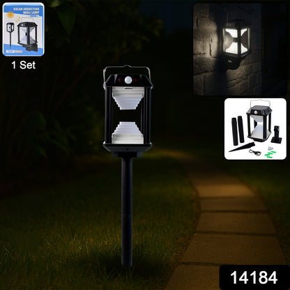 Wukusy garden solar induction LED wall lamp with motion sensor, mounted on outdoor wall, illuminating garden area at night.