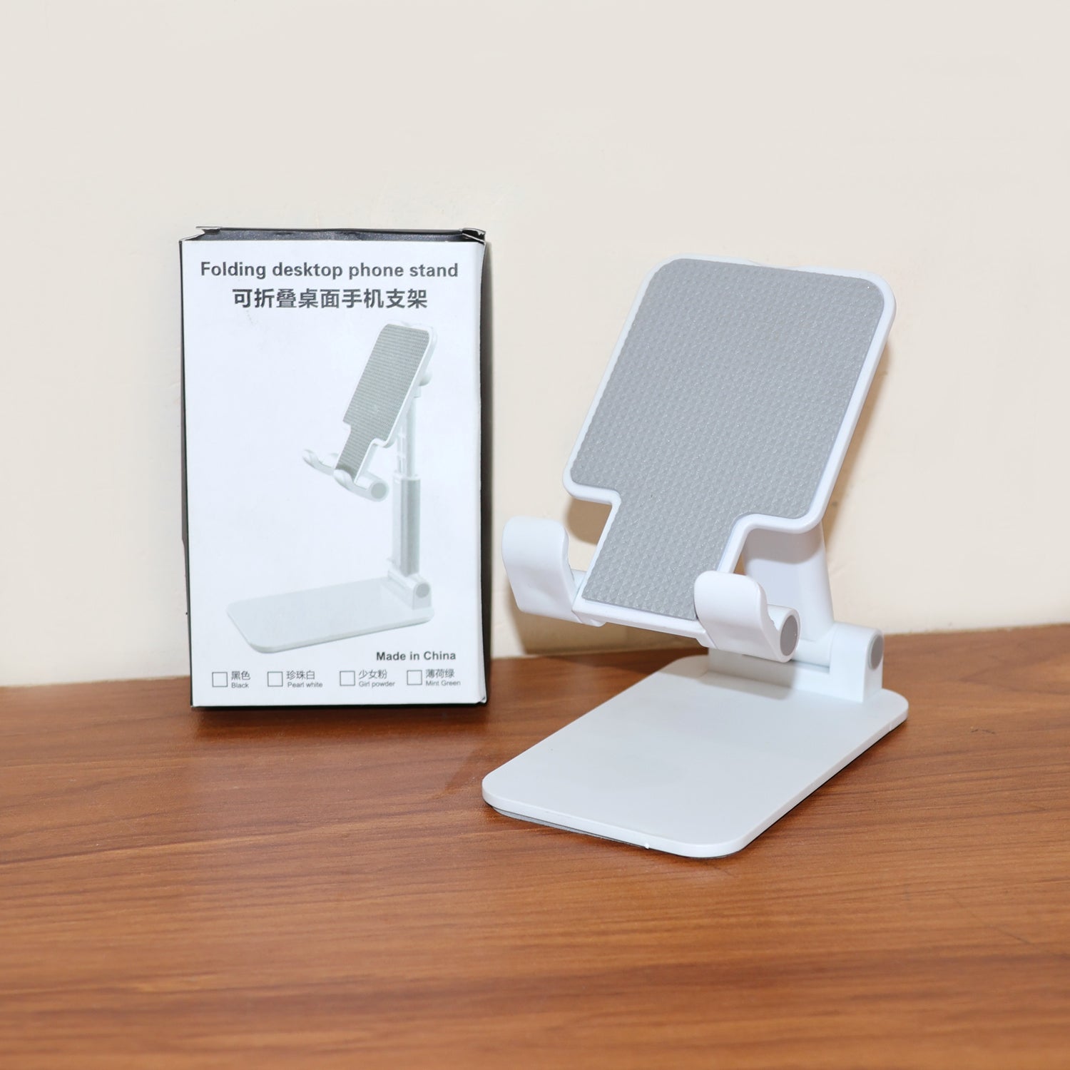 Wukusy adjustable foldable desktop mobile stand holding a smartphone, compact and portable for easy viewing and hands-free use.