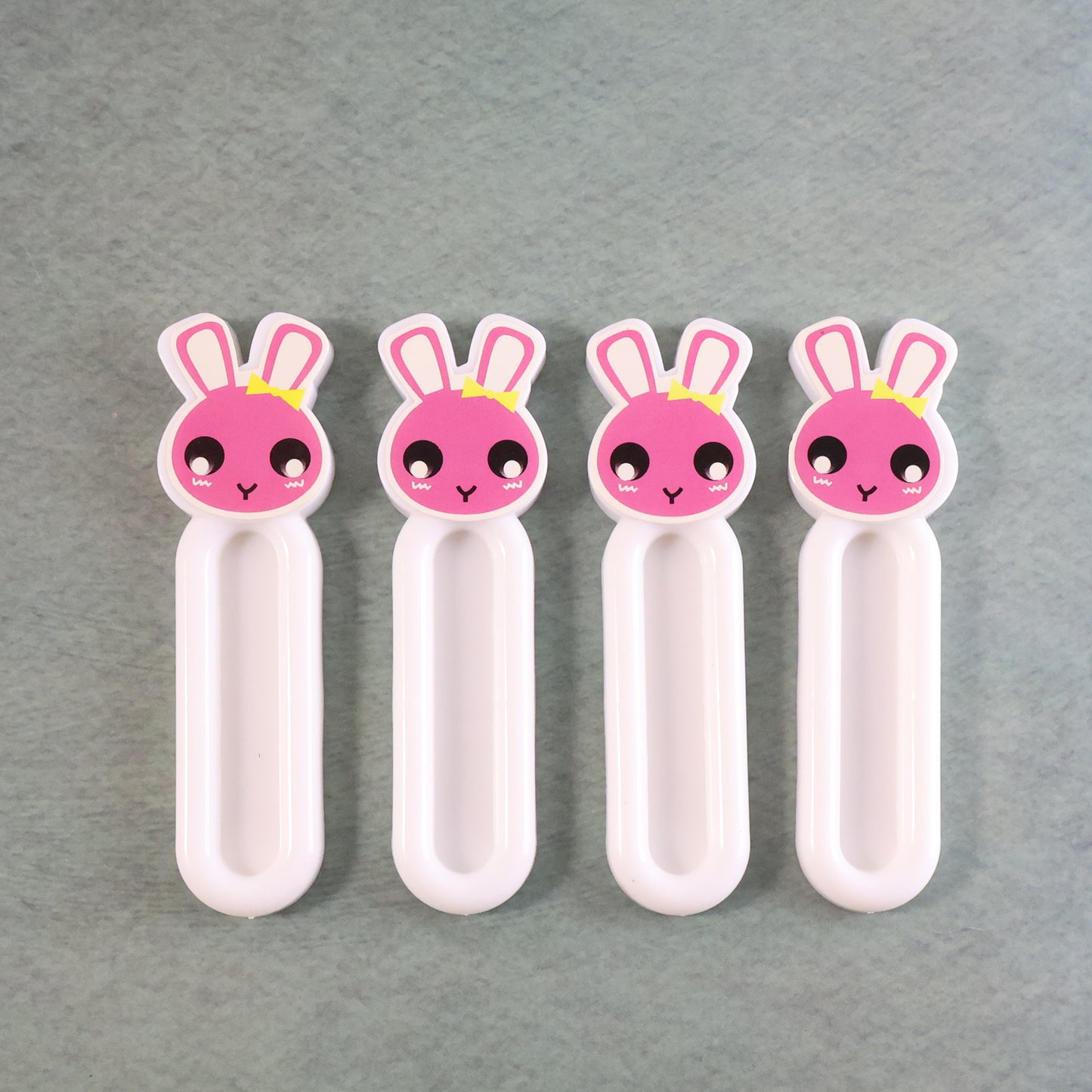 Set of four Wukusy Self Stick Push Pull Helpers for home and kitchen, designed to assist with opening doors and drawers.