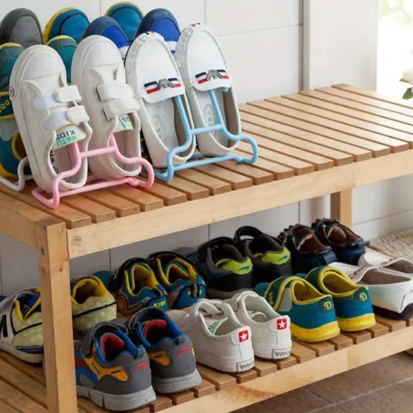Wukusy multi-function shoe rack stand with drying and hanging storage, featuring two durable metal shelves and shoe organization space.