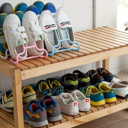 Wukusy multi-function shoe rack stand with drying and hanging storage, featuring two durable metal shelves and shoe organization space.