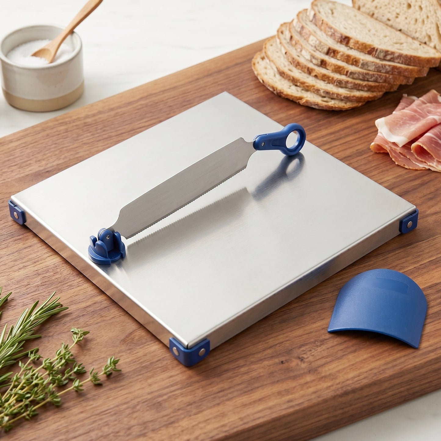 Wukusy stainless steel 2-in-1 cutting and chopping board with knife finger guard, displayed with knife and food preparation surface