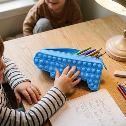 Colorful cartoon crocodile-shaped Pop It pencil pouch by Wukusy, featuring a fun, squishy design for kids' school supplies.