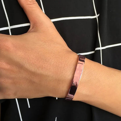 Elegant rose gold-plated open cuff bracelet by Wukusy, featuring a sleek, minimalist design for fashionable wristwear.