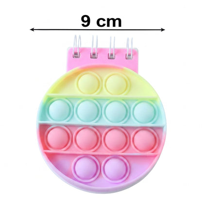 Wukusy Mini Pop It Diary Fidget Notebook for Kids with rainbow silicone bubble popper on the cover.