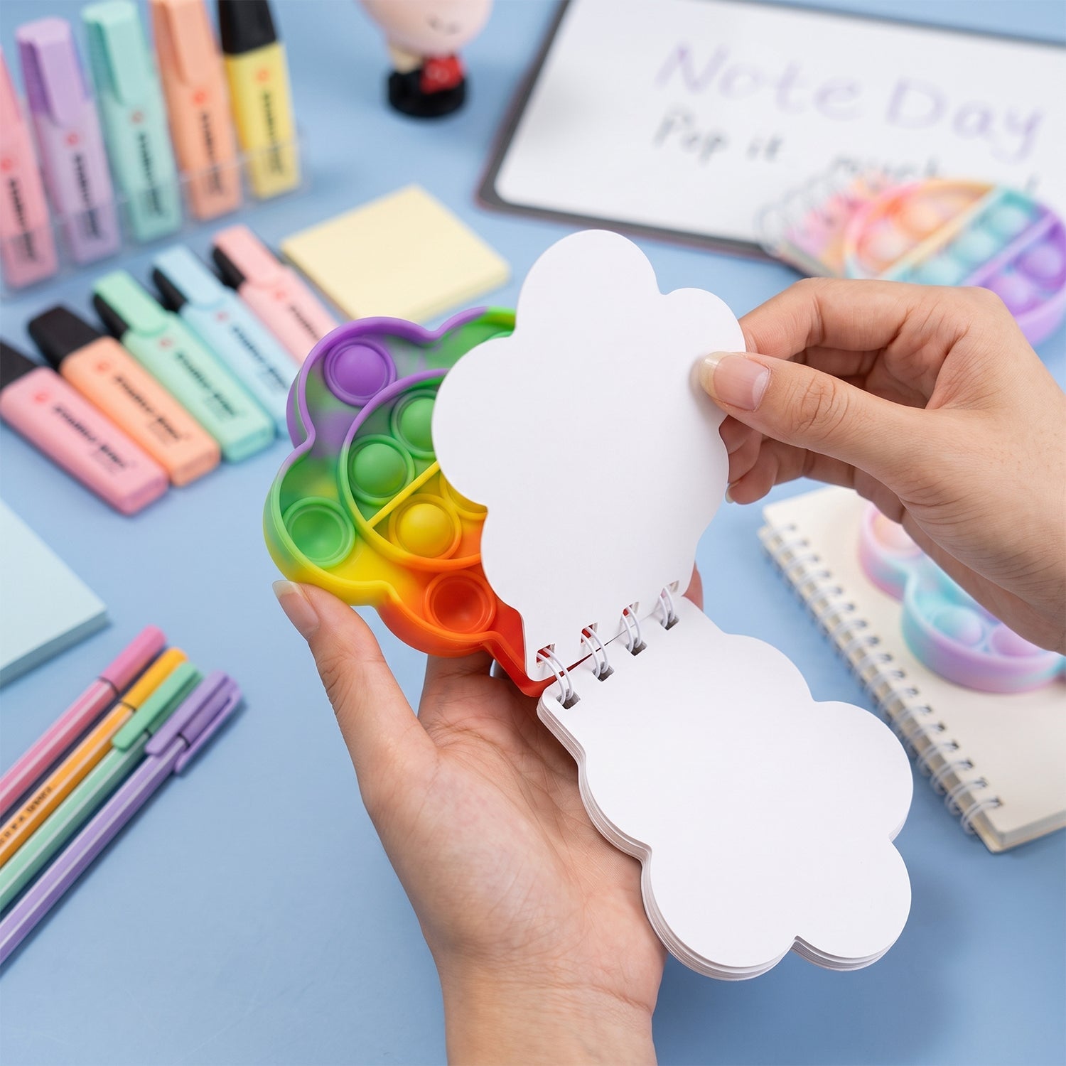 Colorful Rainbow Push Bubble Pop It fidget diary notebook for kids by Wukusy, featuring silicone bubbles for tactile fun and stress relief.