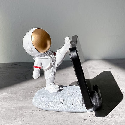 Wukusy astronaut-themed mobile holder stand with 3D planet design, perfect for supporting smartphones creatively.