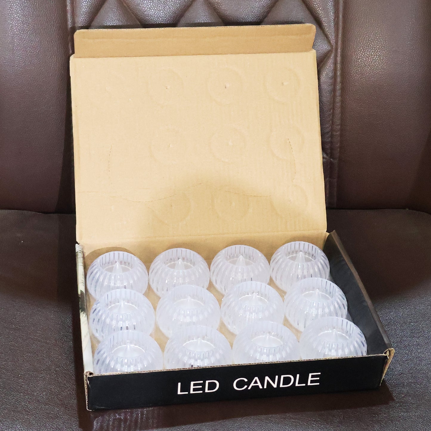 Set of 12 Wukusy LED crystal-effect flameless smokeless decorative candles for home decor, showcasing flickering candlelight in a cozy setting.