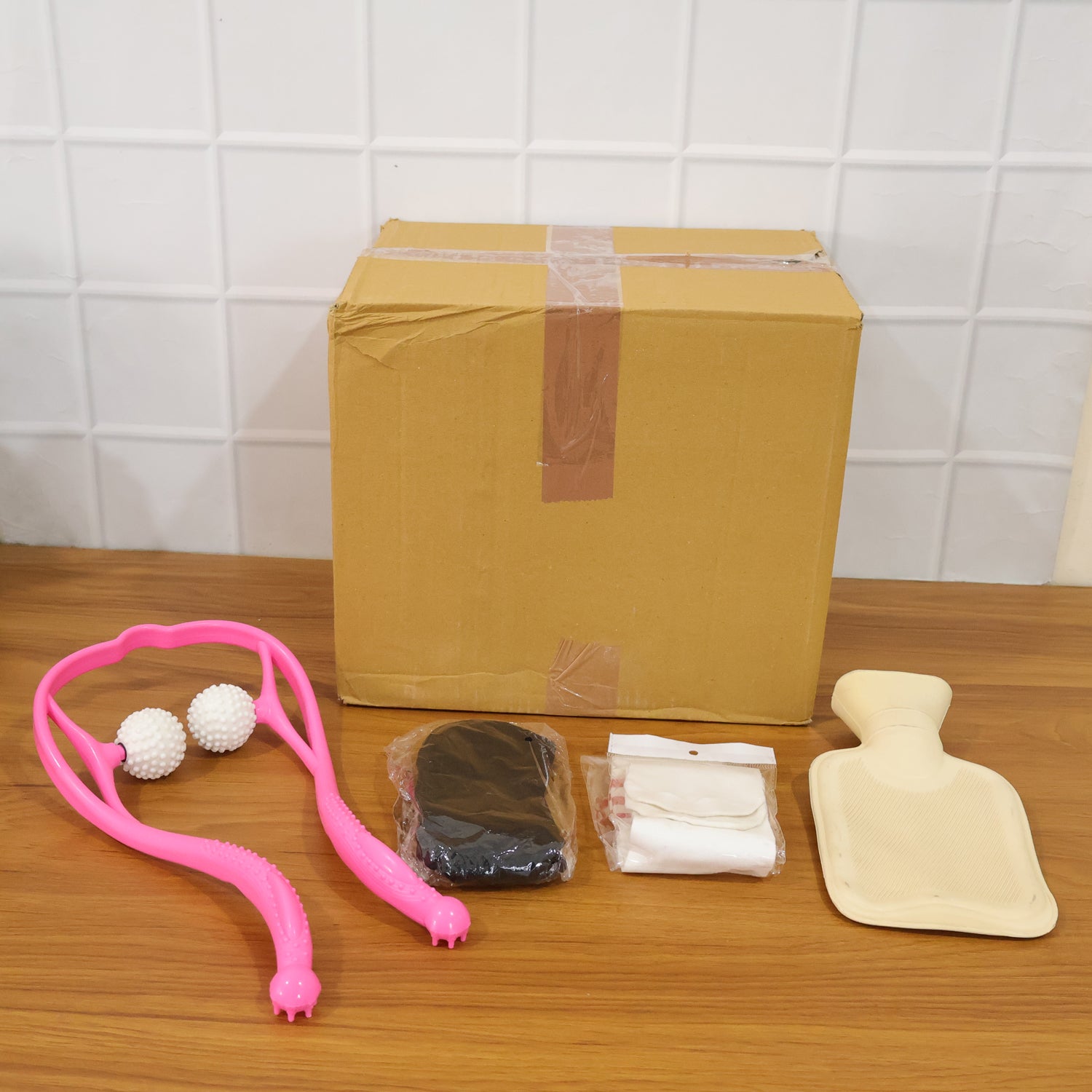 Wukusy self-care and relaxation combo set with candles, essential oils, and massage tools arranged for a calming experience.