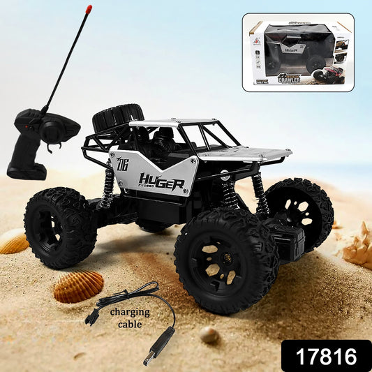 Wukusy 1:18 scale rock crawler monster RC truck performing stunts on outdoor terrain, rechargeable all-terrain toy car for kids