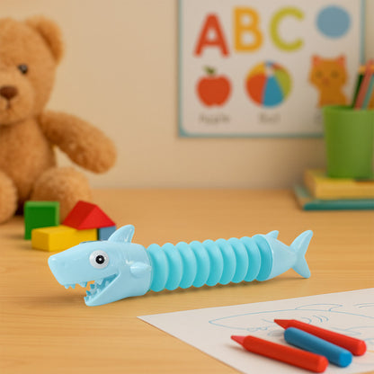 Wukusy shark shape magic spring toy coiled in a vibrant, colorful design ready for play and fun.